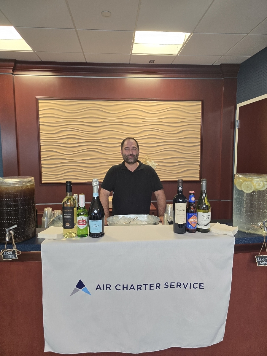 Bartender preparing cocktails at a service table